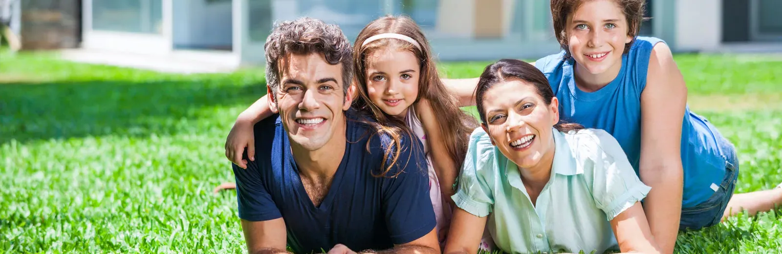 Happy family outside enjoying yard