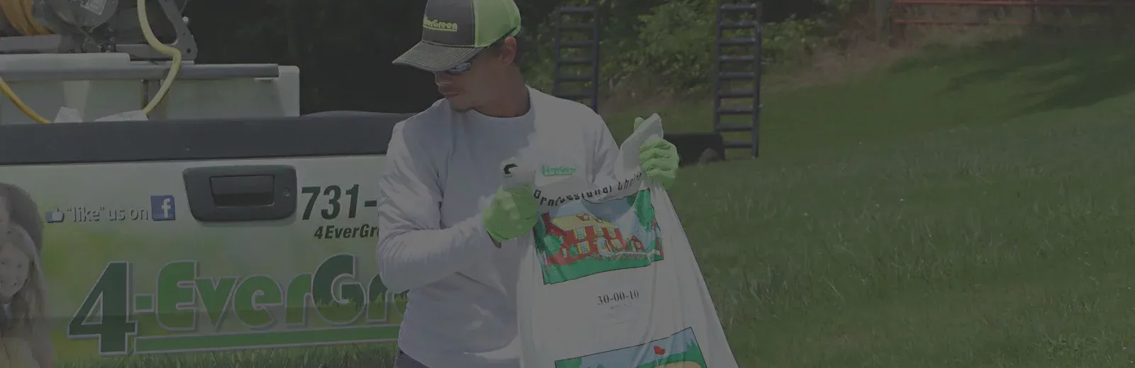 4-EverGreen Lawn Tech working on lawn